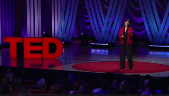 Paige Hamilton on stage giving a TED talk