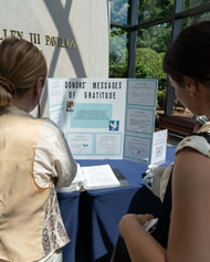 Two women look at poster